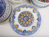 a lot of plates that are sitting on a table