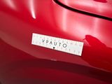 a sticker that says vauto on the back of a red car