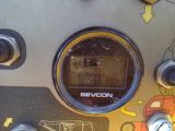 a close up of a clock on the side of a machine