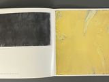 an open book with a picture of a yellow and black painting on it