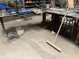 a man that is standing in the middle of a work area