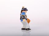 a figurine of a baseball player holding a bat