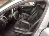 the interior of a car with black leather seats and a steering wheel