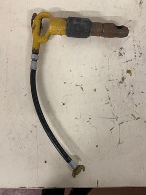 a yellow and black hose attached to a white wall