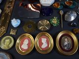 a table with a lot of antique items on it