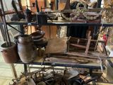 many pots and pans on a shelf in a room