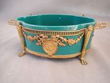 an image of a blue bowl with a gold decoration on it