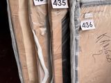 boxes of mattresses are stacked on top of each other in a warehouse