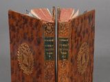 an old book is open to show the inside of it