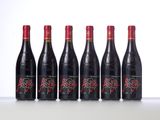 six bottles of red wine lined up in a row