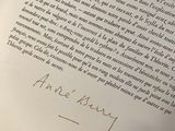 a close up of an open book with writing on it