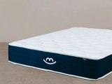une image représentant un matelas sur lequel figure un smiley