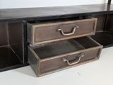 two drawers that are open on the side of a table