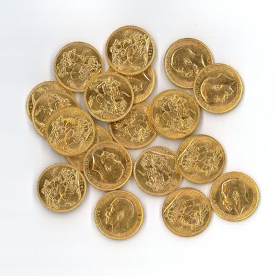 some gold coins on a white surface with a white background