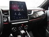 the dashboard of a car with a tablet on the dashboard