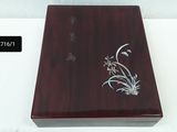 a wooden box with a design on it on a table