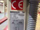 a sticker on the side of a machine in a warehouse