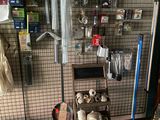 a rack with various items hanging on it in a room