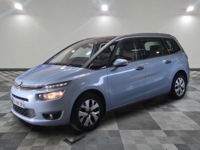 the blue citrole is parked on a checkered tile floor
