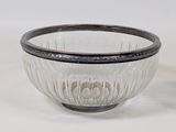 a glass bowl that is sitting on a table