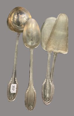 three silver spoons and a spoon with a tag on them