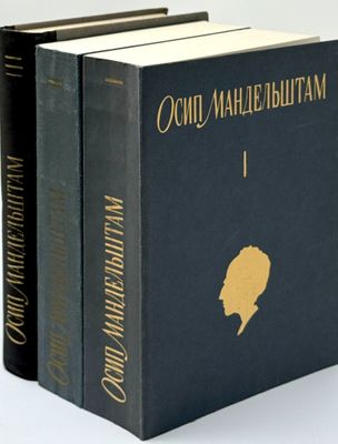 three books are stacked on top of each other on a white surface