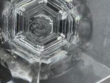 a snowflake that looks like a hexagon in the middle of the picture