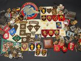 a lot of badges and other items on a table