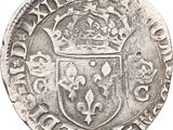 an old silver coin with a crown on top of it