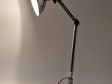 a lamp that is sitting on a table with a cord