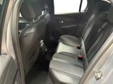 the back seats of a car with a remote control in it
