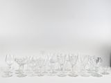 bottles and glasses on a white table with a white background
