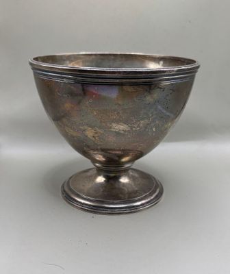 an image of a silver bowl on a pedestal on a white background