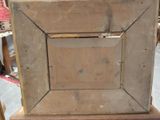a picture of an old wooden picture frame on a table