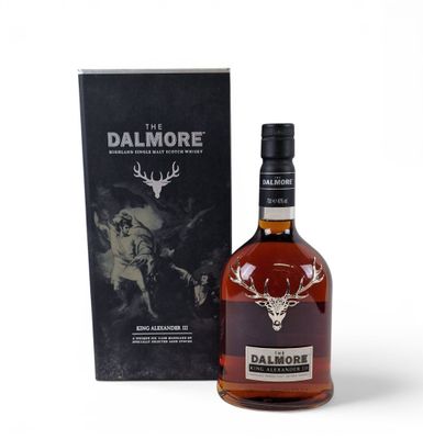 a bottle of dalmore single malt whisky next to a box