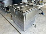 a stainless steel sink in the middle of a kitchen
