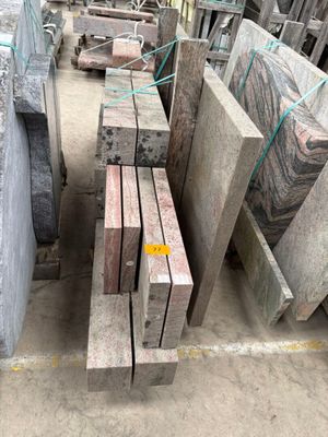 many different types of granite blocks in a warehouse