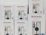 four boxes of brabantia coffee machines sitting on top of a table