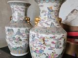 two vases that are sitting on a table