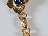 a close up of a bracelet with a star on it