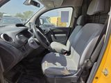 a yellow car with a gray seat and a black steering wheel