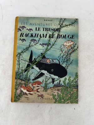 an old children ' s book with a picture of a shark and a crab