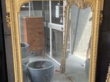 two mirrors sitting next to each other on the floor