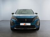 the front view of a blue car in a white room