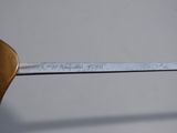 a close up of a metal object with a ruler on it