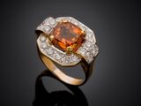 an orange sapphire and diamond ring