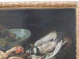 a picture of a painting of a bird and a duck on a table