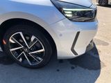 a close up of a white car parked in a parking lot