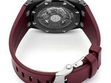 the watch has a red rubber strap around the strap