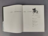 an open book with a drawing of a man on a horse